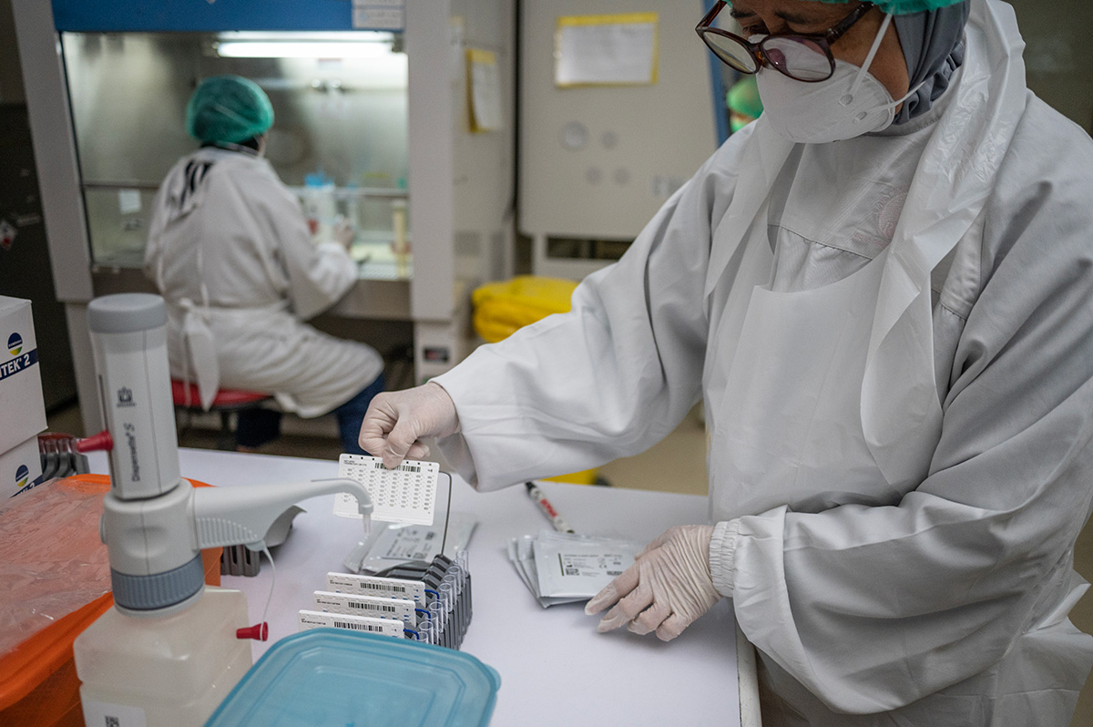 A laboratory staff performs a bacterial resistance test at the Persahabatan hospital laboratory, Jakarta.