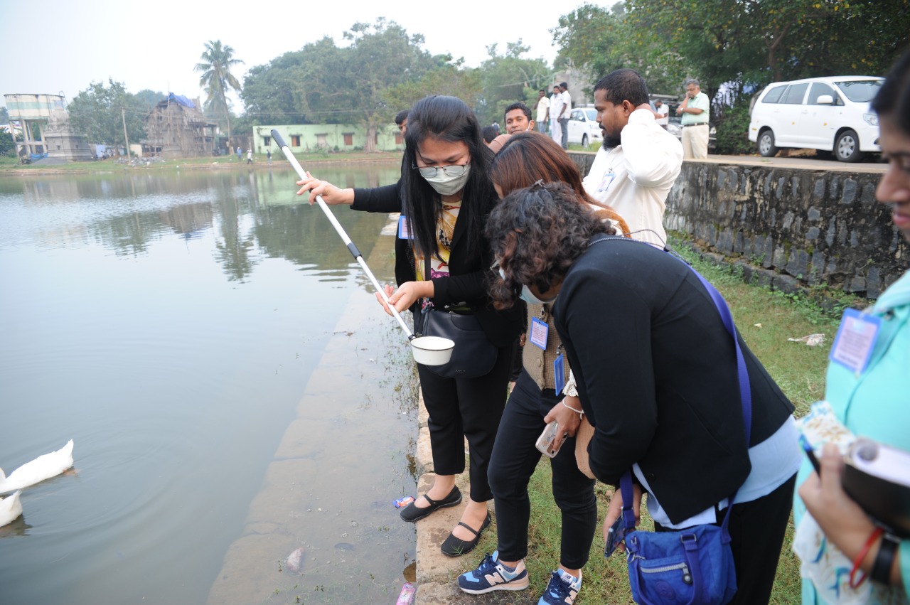 Participants practicing mosquito larva collection